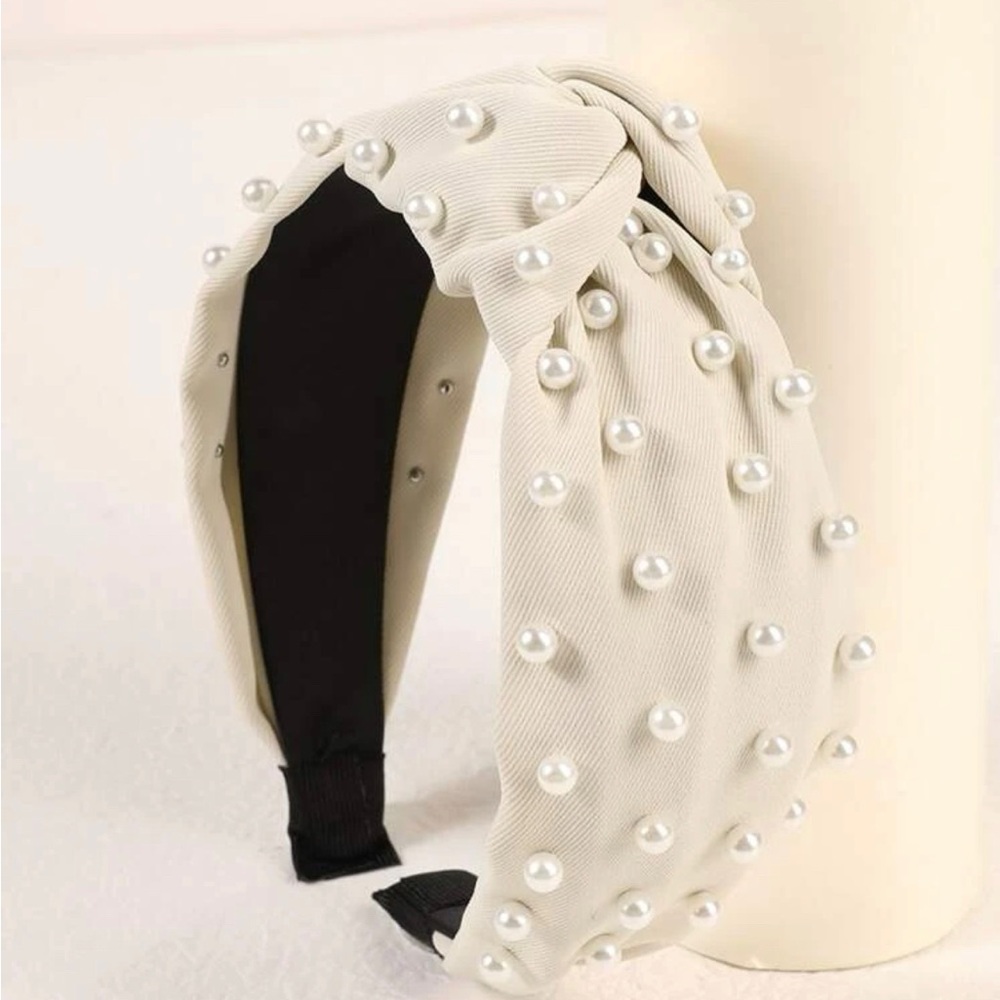 Bran new headband in package. Pearl white